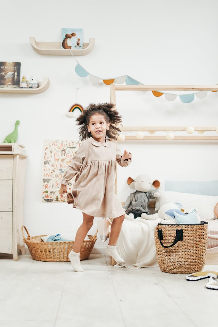 A joyful child dances in a colorful playroom, exuding innocence and fun.